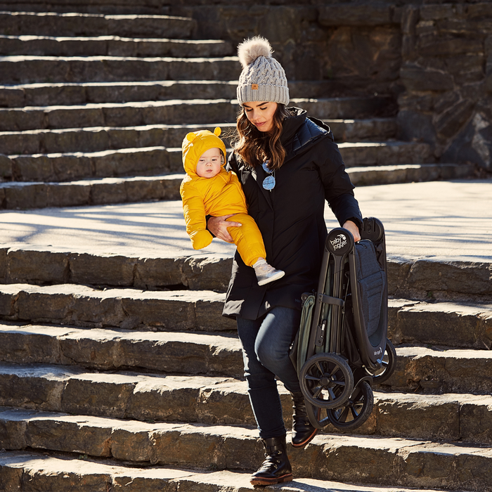 Baby Jogger city mini® GT2 Opulent Black  - folded walking down stairs